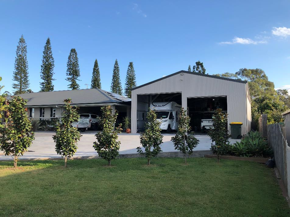 Free-standing garage with two roller doors