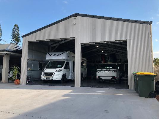Free-standing garage with two roller doors